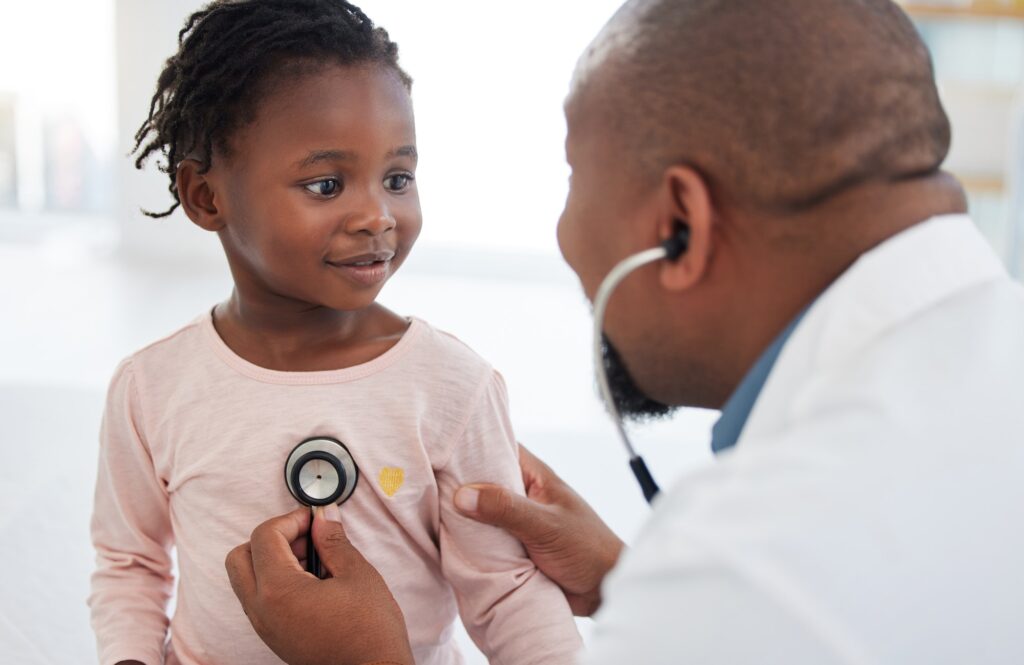 Healthcare, trust and medical consulting with doctor and child at hospital, exam with stethoscope.